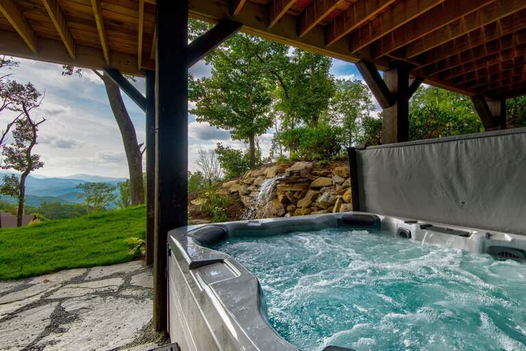 Scenic Soak In A Highland Hot Tub Under A Wooden Shelter With Mountain Views