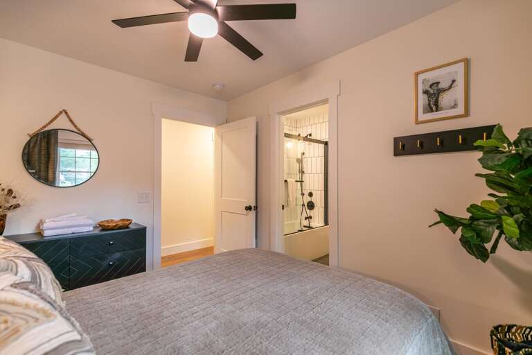 The full bedroom offers an adjacent entry to the shared bathroom