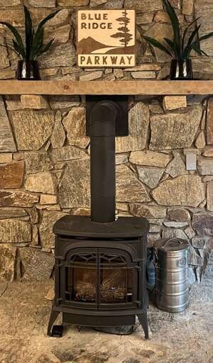 Gather around the classic wood burning stove on mountain evenings