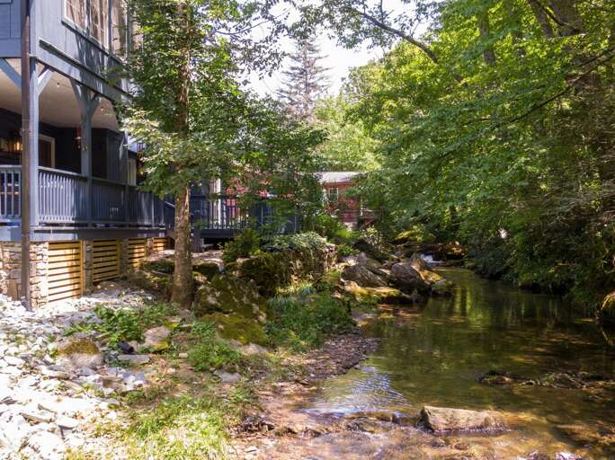 Little ones will love splashing in the river just steps from the home