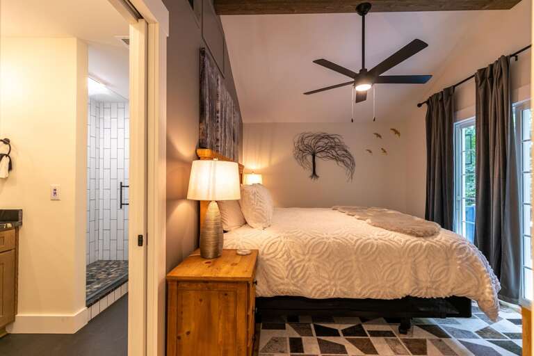 The primary bedroom offers convenient access to the ensuite bath