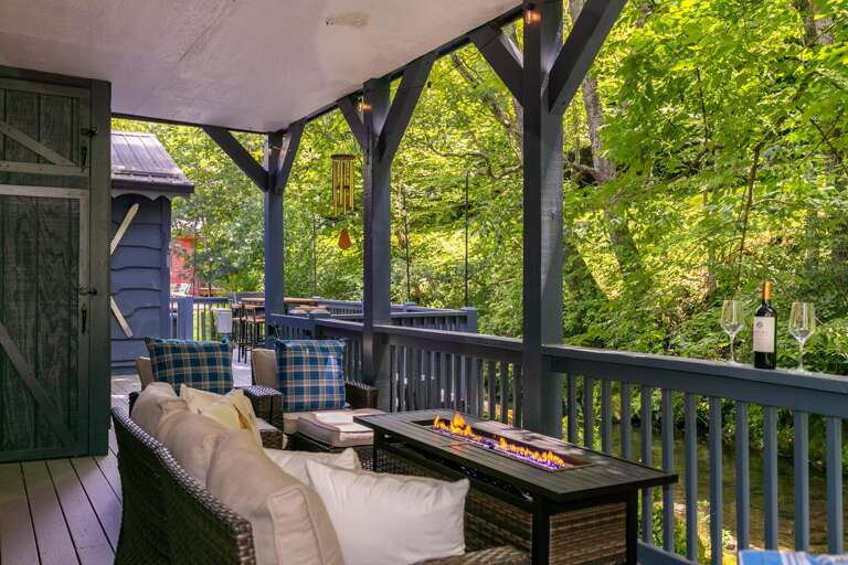 turn on the propane fire table as you settle into the comfortable deck furniture