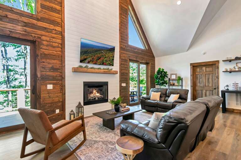 Family room has 2 reclining leather sofas