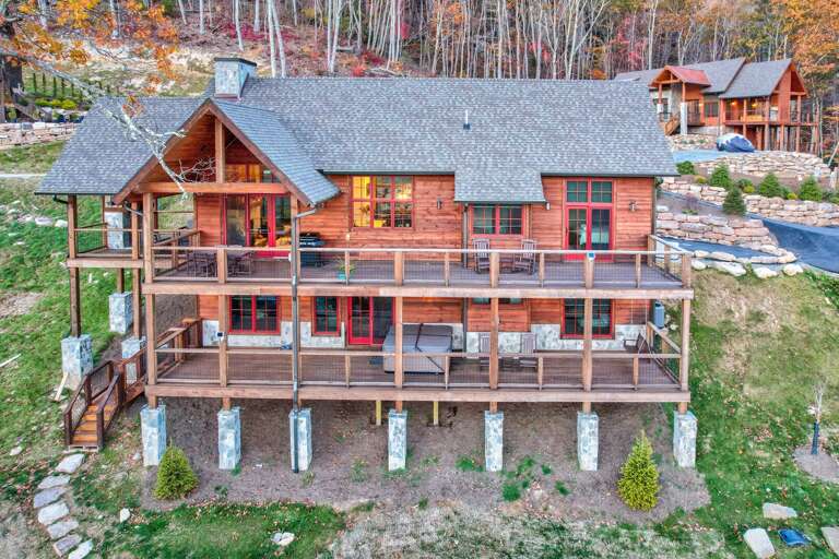 Large Wooden Cabin With Multiple Balconies Nestled In Nature