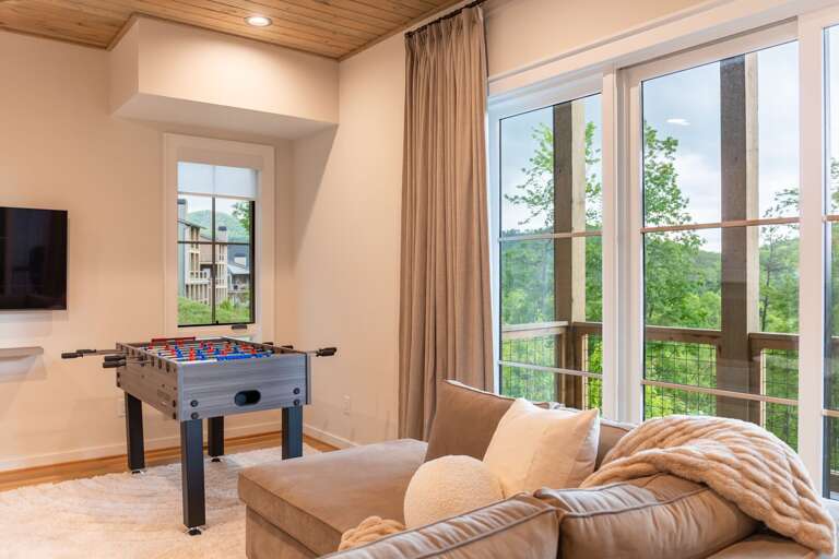 Foosball and mounted TV