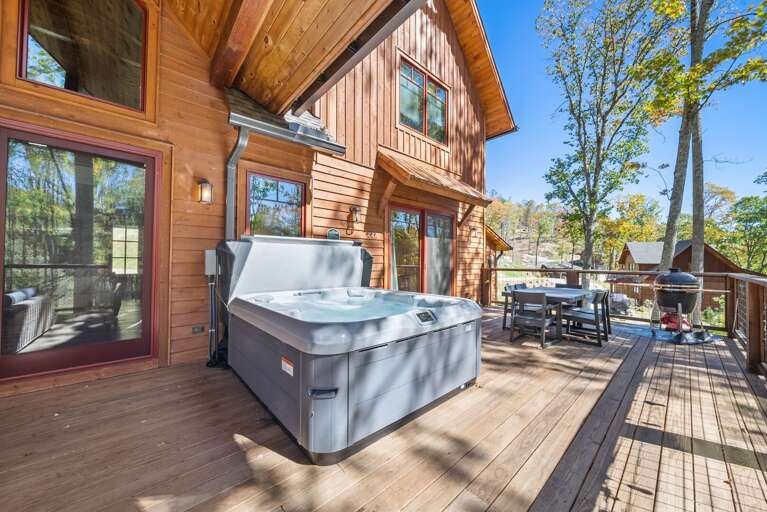 Wooden Vacation Rental With Sunny Skies, Spacious Deck, And A Hot Tub