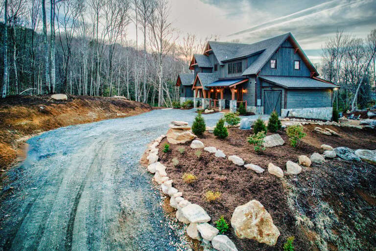 Rustic Residence By Roadside, Flanked By Forest And Frosted Boulders