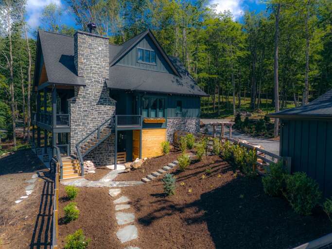 Stately Stone Structure Surrounded By Serene Woods