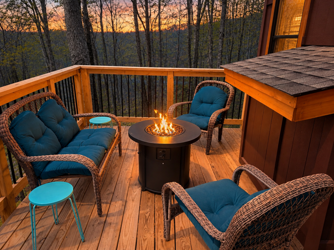 Gather around the warmth of the fire pit on the deck at Bear Necessities, as the sunset glow surrounds you