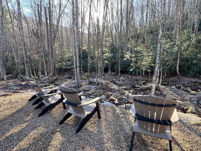 Chairs By A Creek In A Leafless Forest