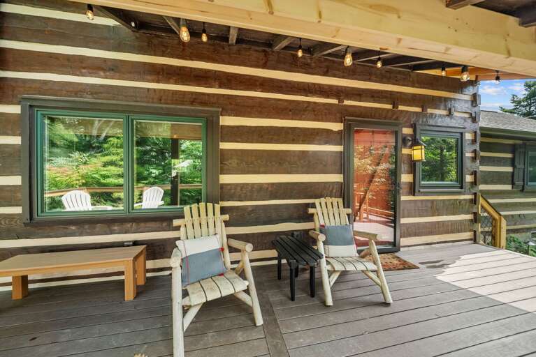 A cozy spot to slow down. Pull up a chair and soak in the wooded calm at Tucked Away.