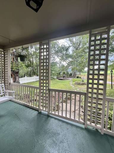 Balcony View Of Breezy, Leafy Landscape From A Vacation Rental