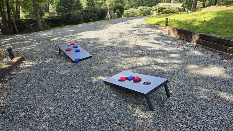 Corn hole set provided to use in the driveway