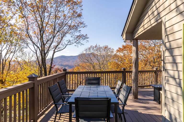 Vacation Rental Deck With Dining Table Overlooking Autumnal Mountain Vista