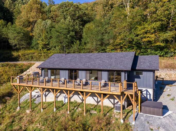 Vacation Rental On Raised Wooden Deck Surrounded By Trees