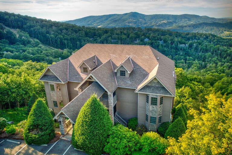 Perched high above the Blue Ridge valley, this mountain retreat offers sweeping views right from the parking area.