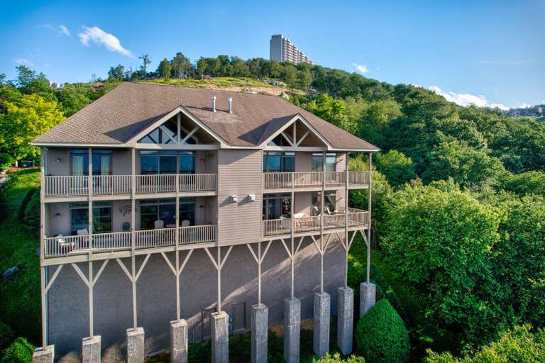 Tucked into the Sugar Mountain hillside, this two-story retreat offers wraparound decks and big windows for soaking in the scenery.