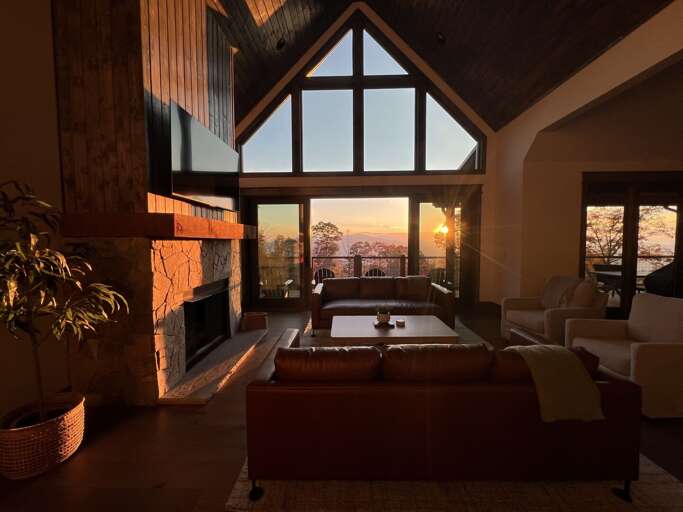 Sunset Streaming Through Spacious Living Space, Sizable Windows Revealing Radiant Views