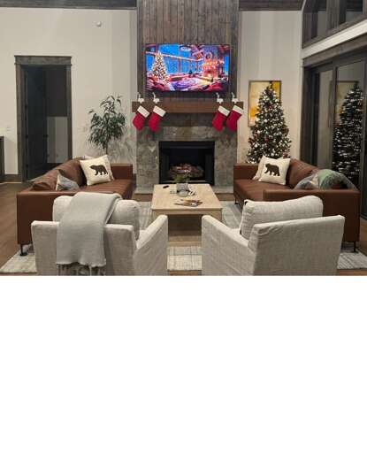 Spacious Sitting Space Sporting Sofa Set, Seasonal Stockings, And Stone Hearth Streaming Sports