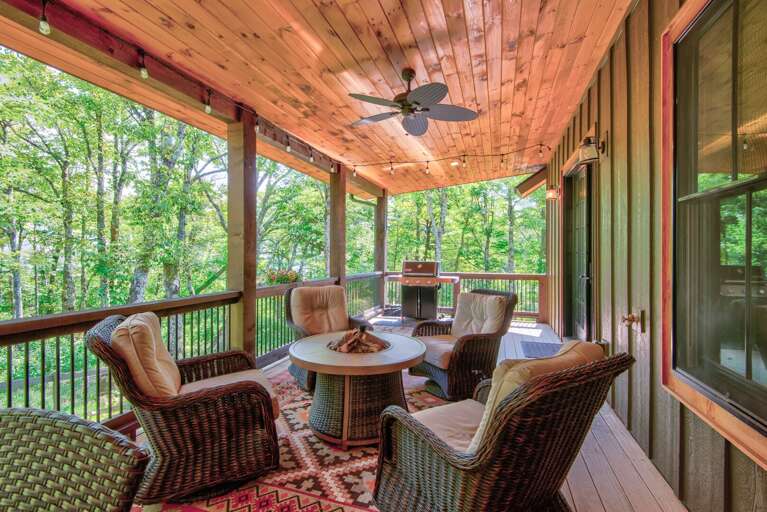 Covered deck comfortable seating at The Sugar Chalet
