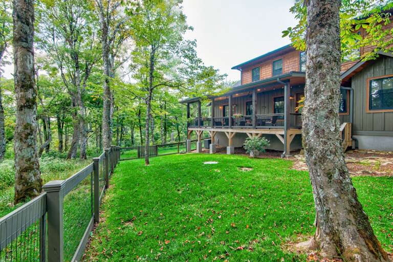 Treasure in the mountains with manicured lawn and fenced in yard