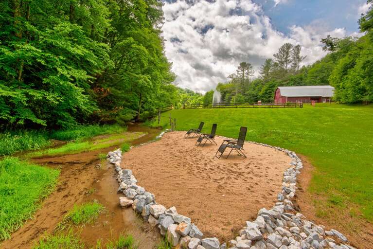 A private beach next to the creek with a soaring fountain and the iconic red barn. Pure Blue Ridge charm.