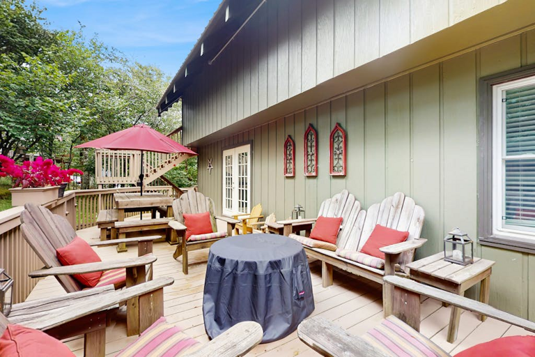 The deck space here is as inviting as the inside, with lots of Adirondack chairs ready for you to relax and enjoy the cool mountain air around the gas firetable!
