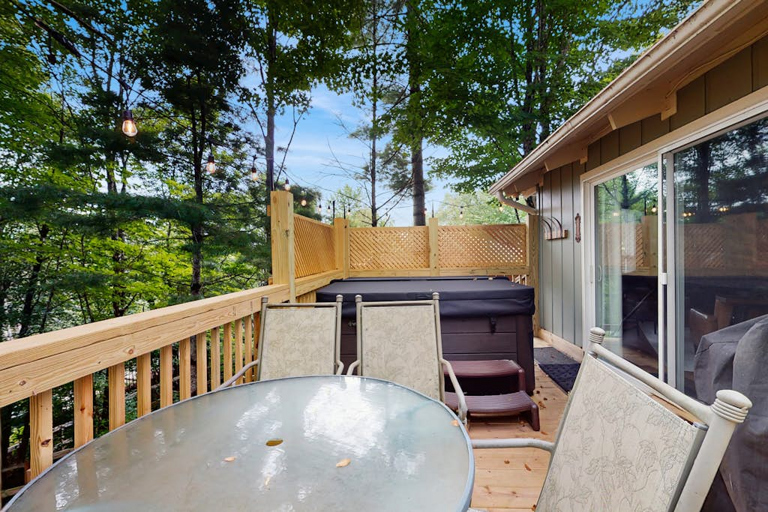 The hot tub is fenced for privacy from the nearby neighbors.