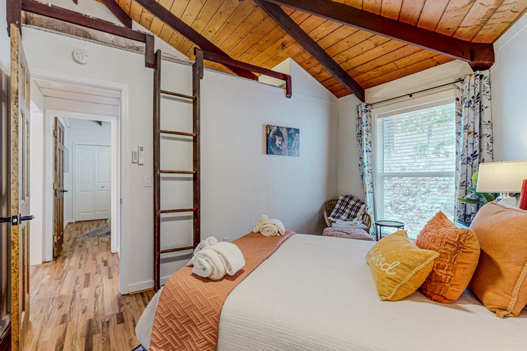 The second Queen bedroom at The Beech Hut features a ladder to a kids' reading nook!