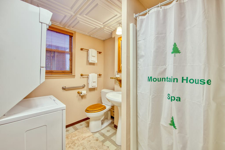 The third full bathroom at Crawdad Corner offers a shower and stackable washer/dryer.