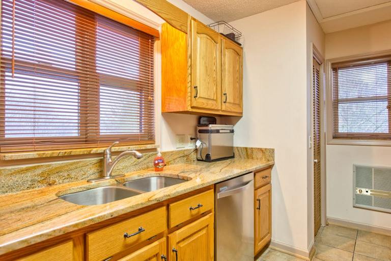 Granite counters and stainless steel appliances in the kitchen