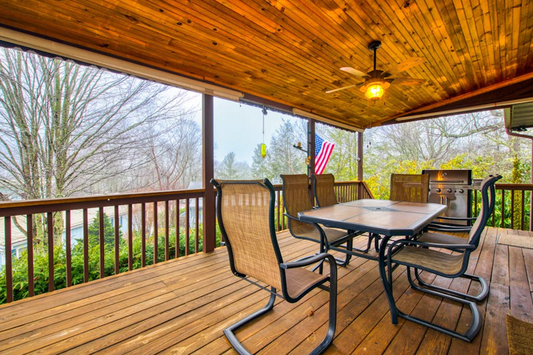 Relax on the covered back porch! Grill up a feast to enjoy together at the patio table.
