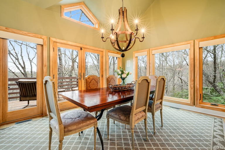 Dine surrounded by treetop views in this bright, window-lined dining space.