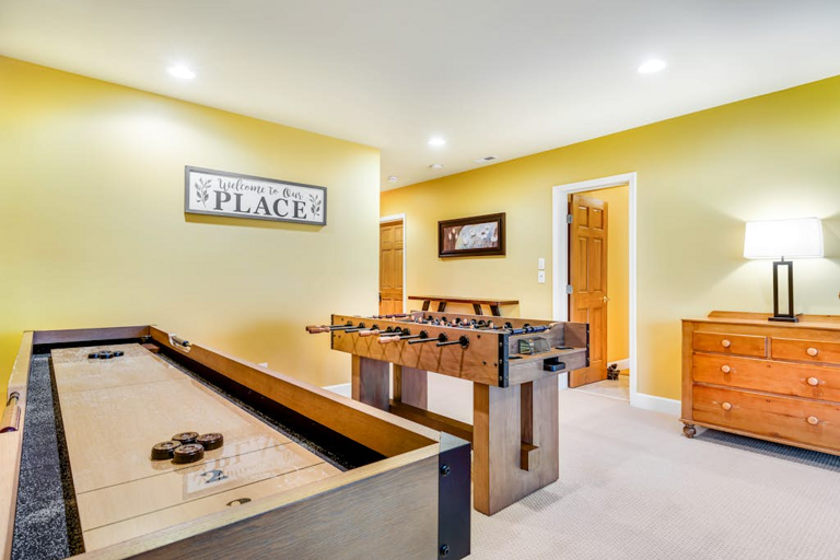 Game night is covered with shuffleboard and foosball ready for friendly competition.