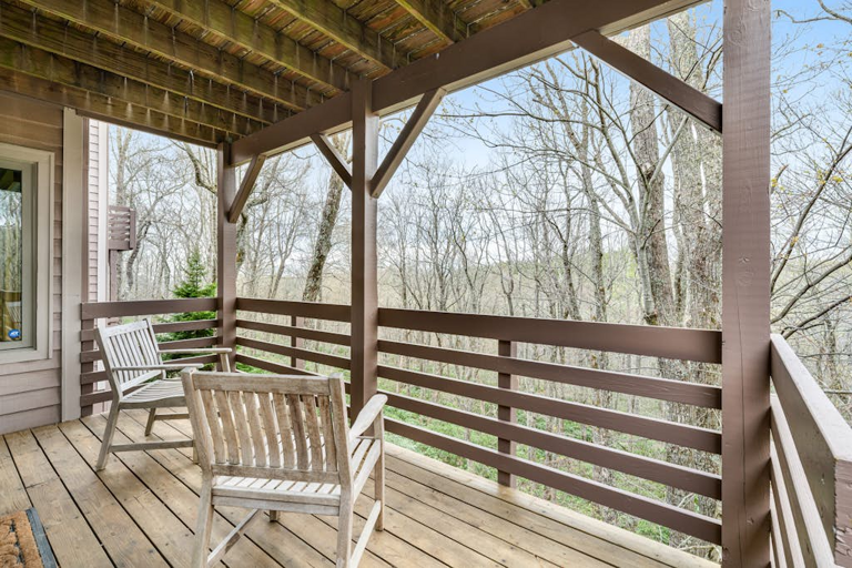 Relax on the covered deck and take in the calm, tree-filled surroundings.