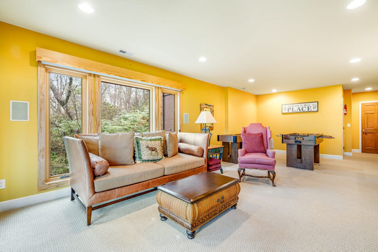 The spacious lower level offers another comfortable spot to gather and unwind.