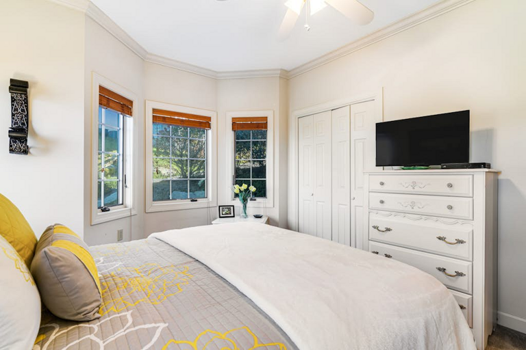The guest bedroom provides a comfortable, light-filled space to unwind and recharge.