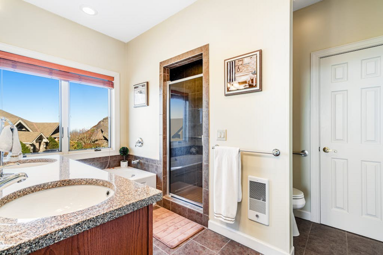 The primary bath offers a relaxing jetted tub and plenty of room to get ready for the day.