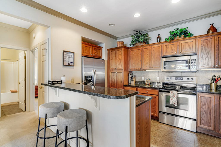 Pull up a seat at the breakfast bar while meals come together in the well-appointed kitchen.