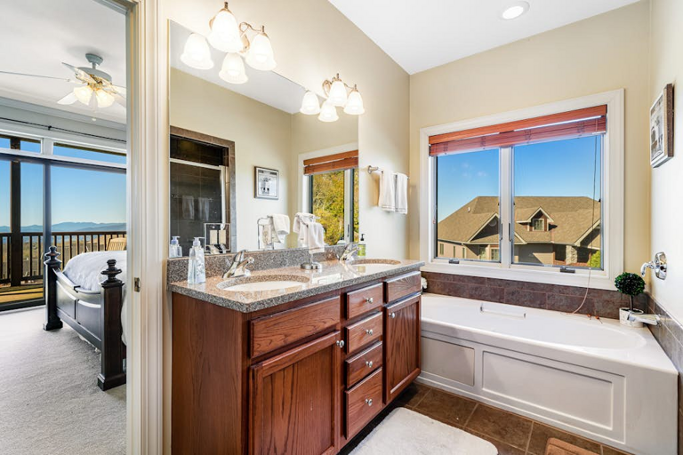 Relax and recharge in a spacious bath with a jetted tub and plenty of vanity space.