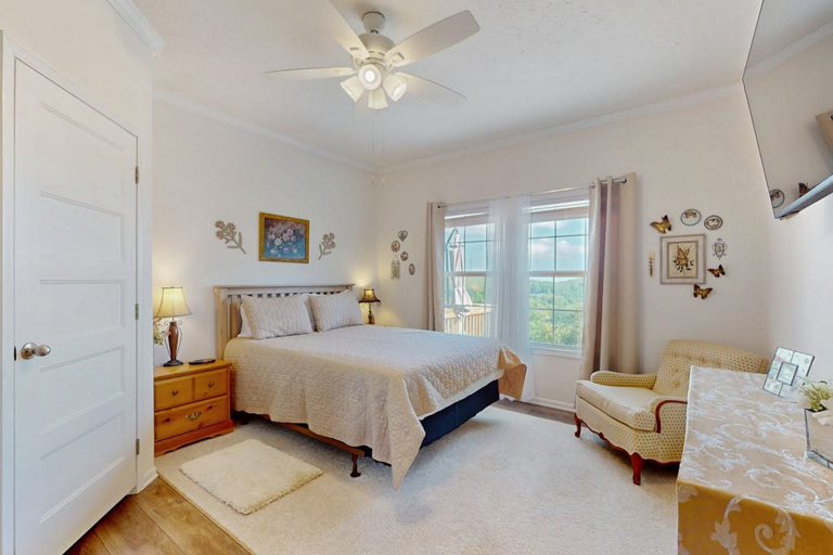 A cheerful guest bedroom offers a comfortable place to recharge after a day exploring the High Country.