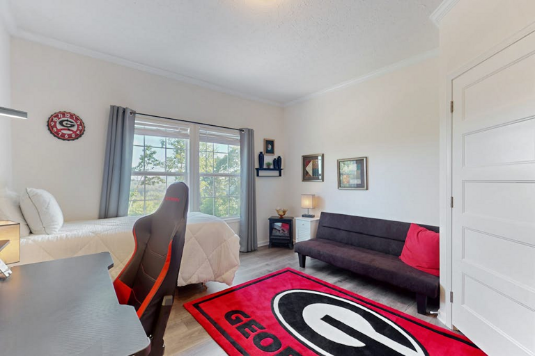 This fun bonus room combines flexible sleeping space with a gaming setup for downtime at the house.