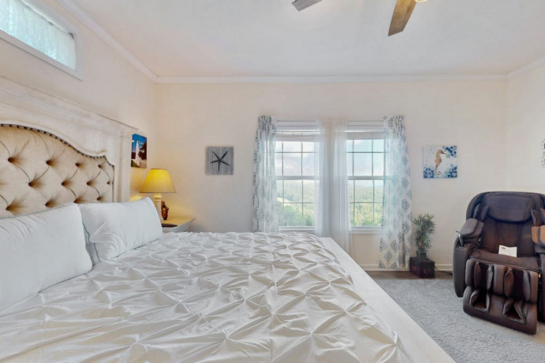 Relax at the end of the day in a comfortable bedroom surrounded by soft colors and natural light.