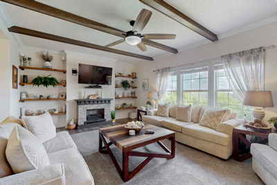 Settle into the bright and welcoming living room at Jennings Roost, where comfortable seating makes it easy to relax together.