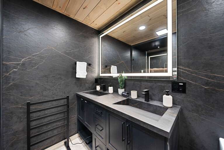 Double vanity ramp sinks and towel warming rack