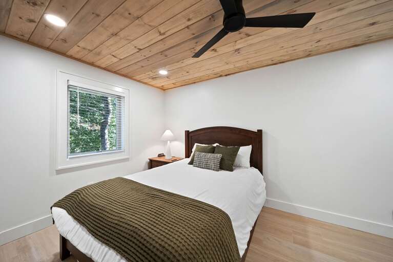 Lower Level 1 Queen Bedroom with curved headboard
