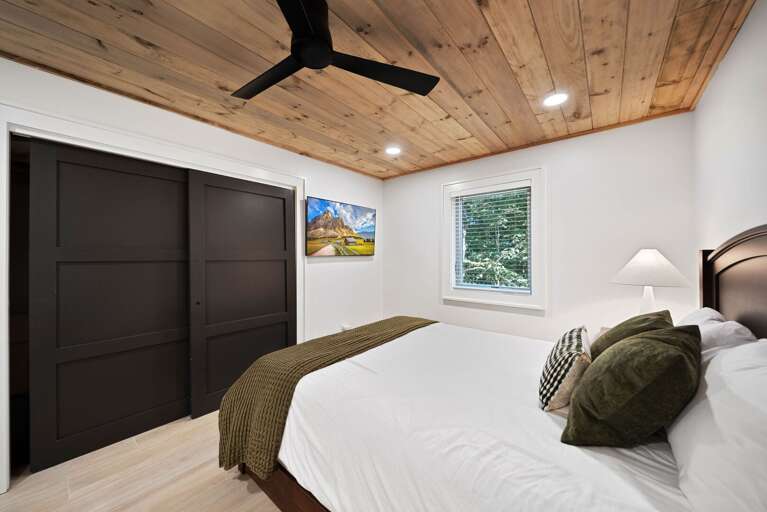 Lower Level 1 Queen Bedroom with curved headboard