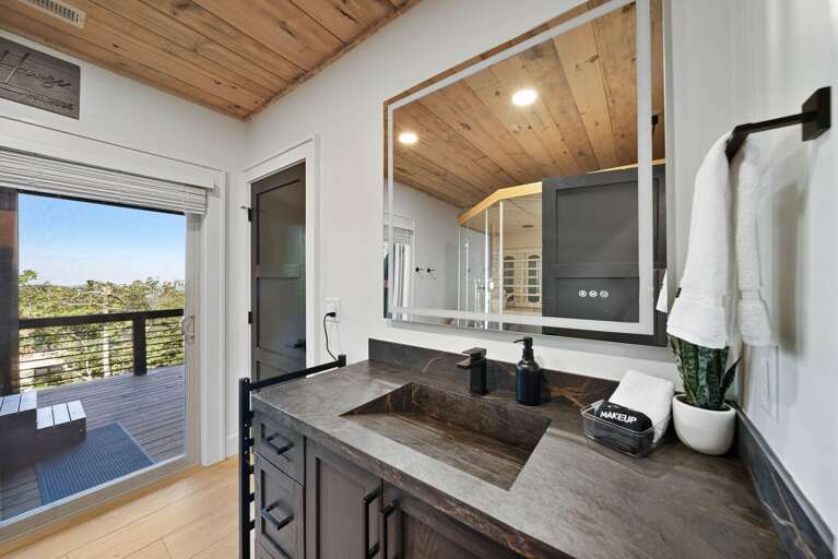 Lower Level 2 Bath with ramp sink, sauna and deck access