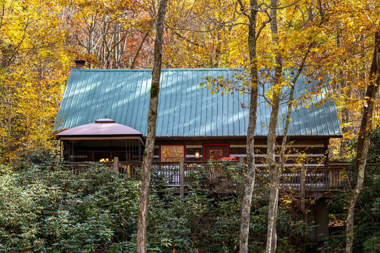 River view of the cabin with new canopy in the fall