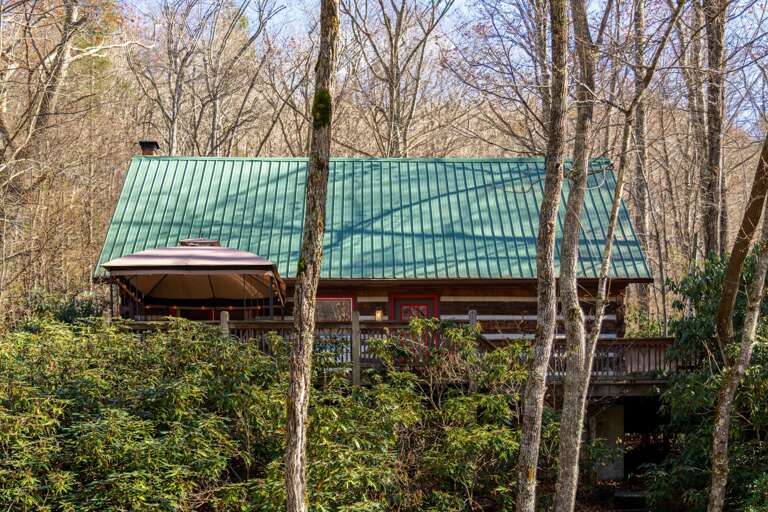 River view of cabin with lighted canopy